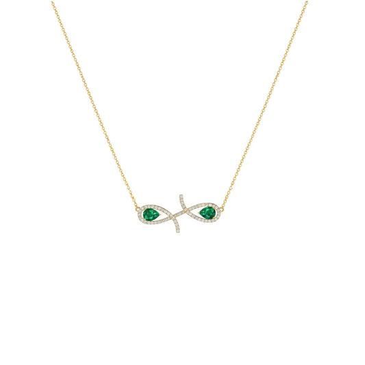Gold necklace with emerald green gemstones on a white background