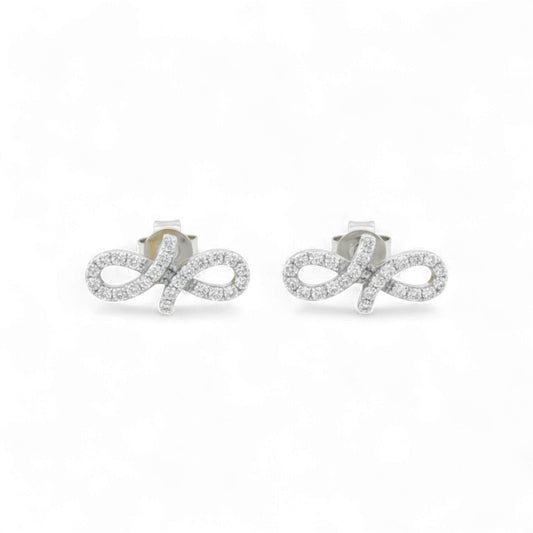 Pair of silver earrings with diamond accents on a white background