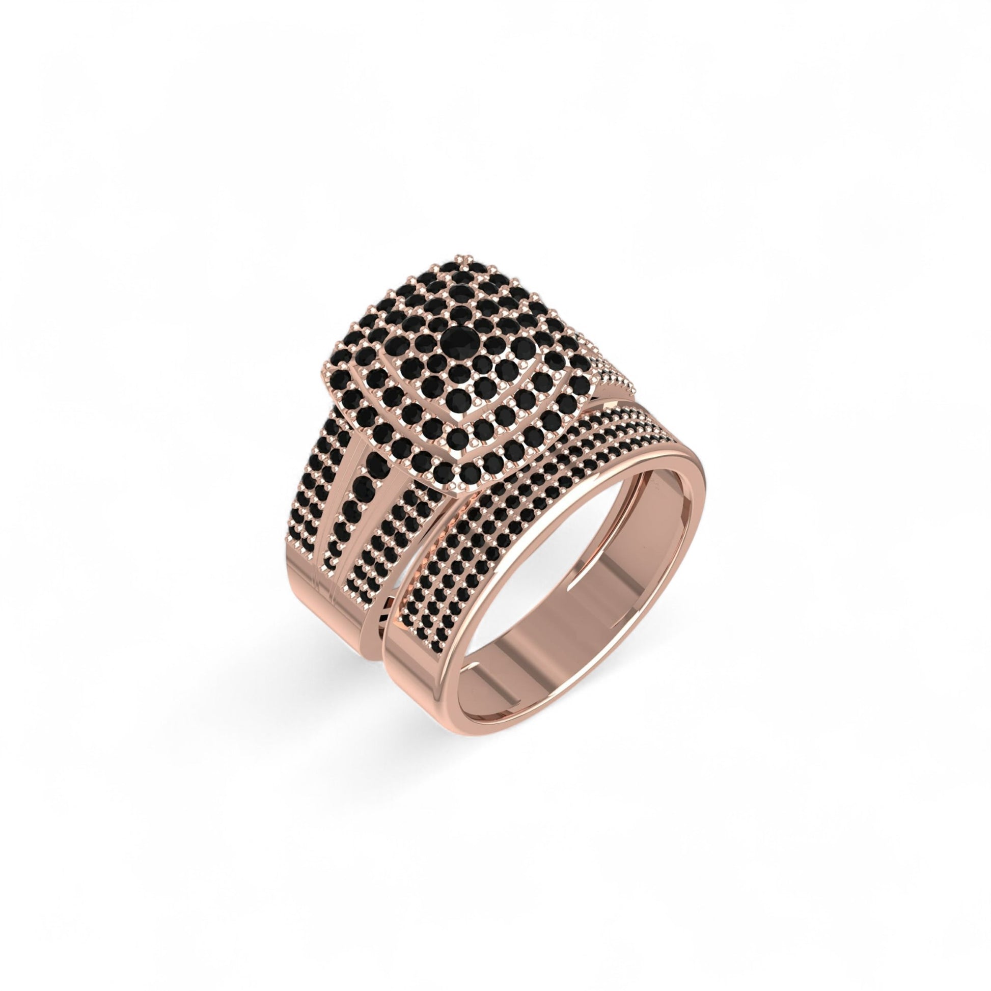 Rose gold ring with black gemstones on a white background