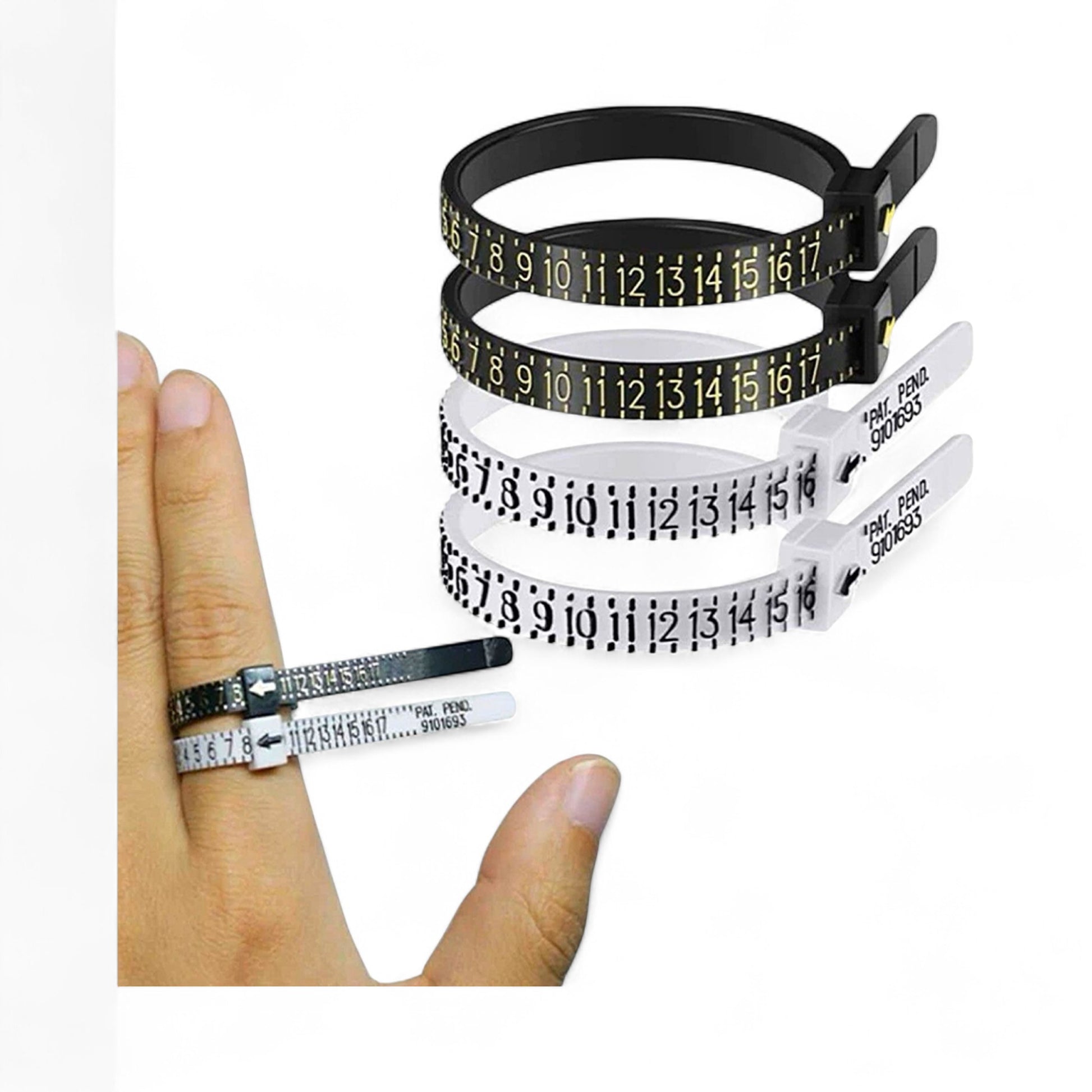 Set of three measuring tapes in black, white, and green held by a hand on a white background.