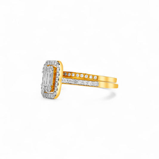 Gold ring with diamond accents on a white background