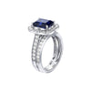 Silver ring with a blue gemstone and diamond accents on a white background