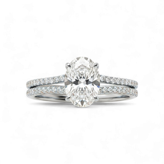 Diamond ring with a matching band on a white background
