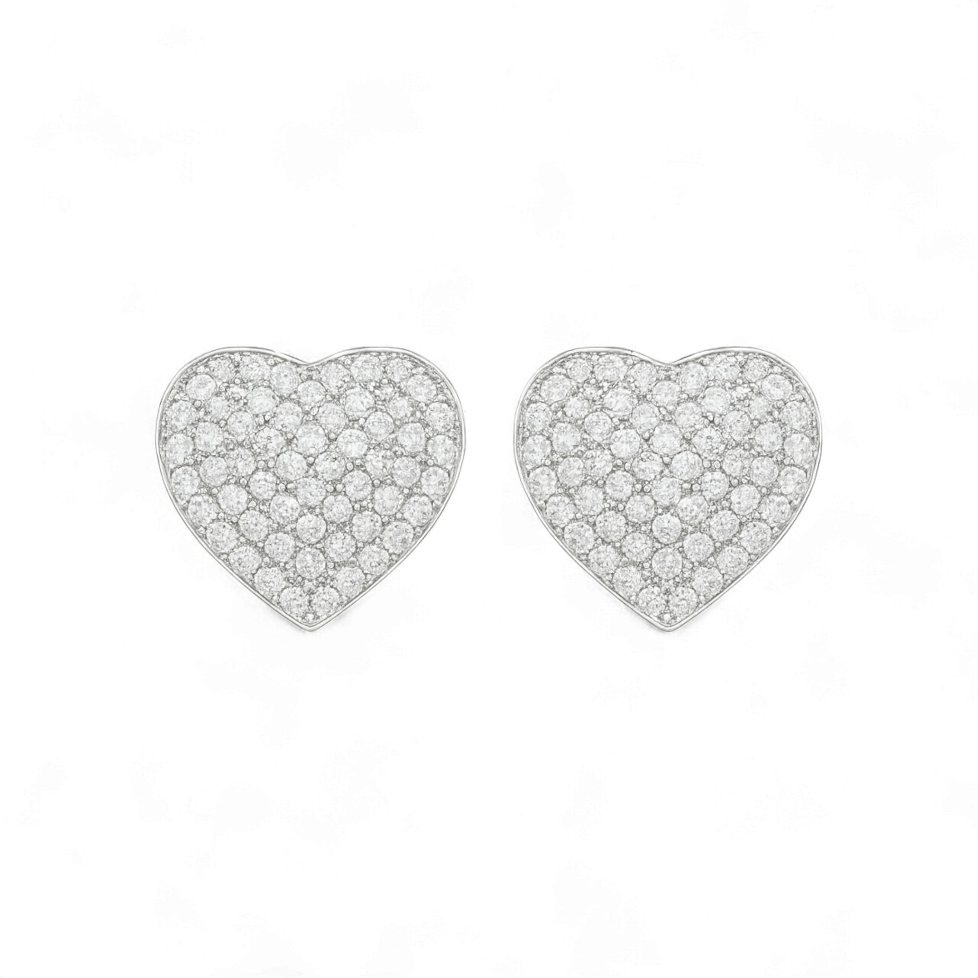 Heart-shaped earrings with clear gemstones on a white background