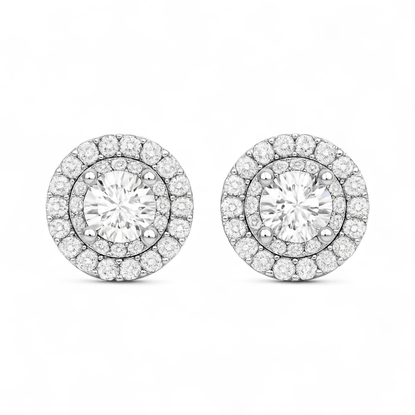 Pair of diamond earrings on a white background