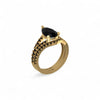 Gold ring with a black gemstone on a white background