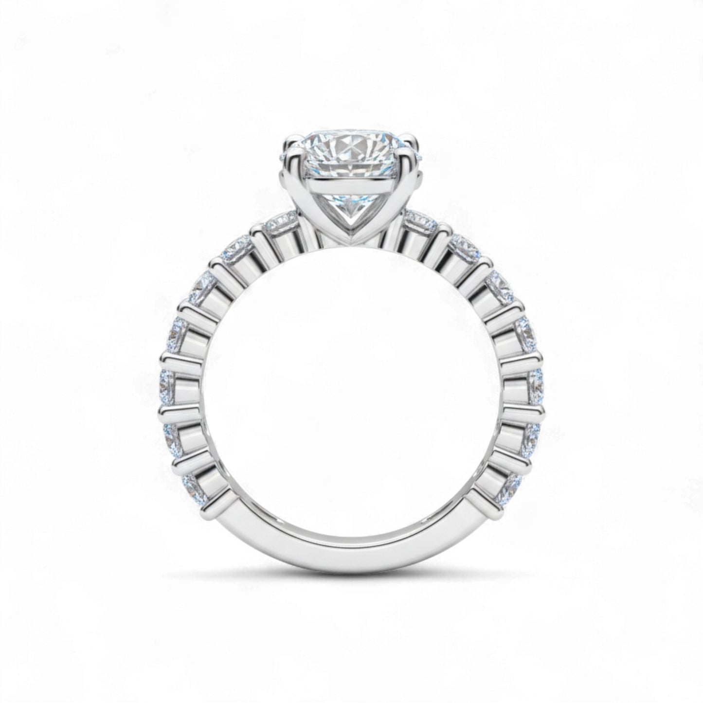 Diamond ring with a central gemstone and smaller stones on a white background