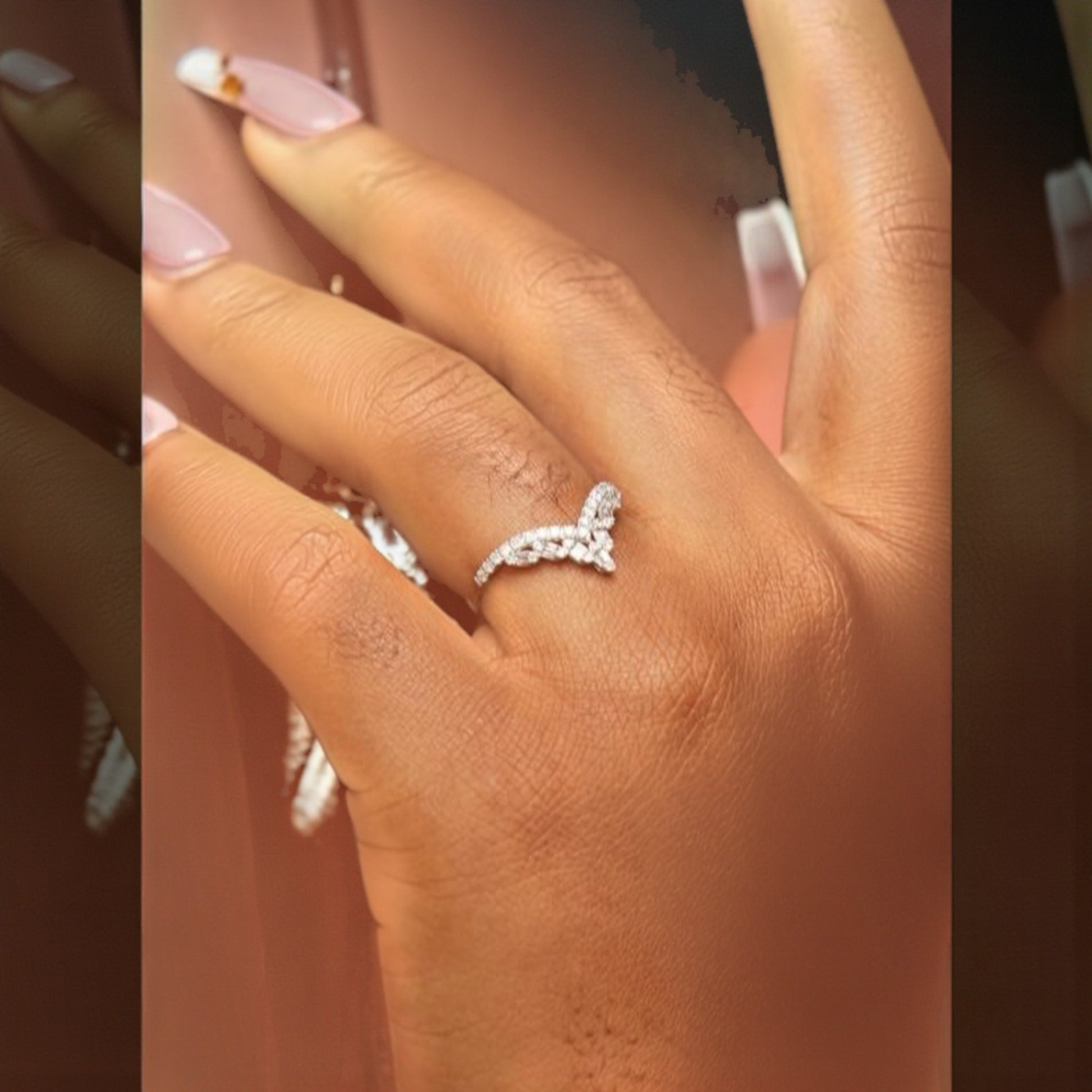 Silver ring on a person's finger with a blurred background