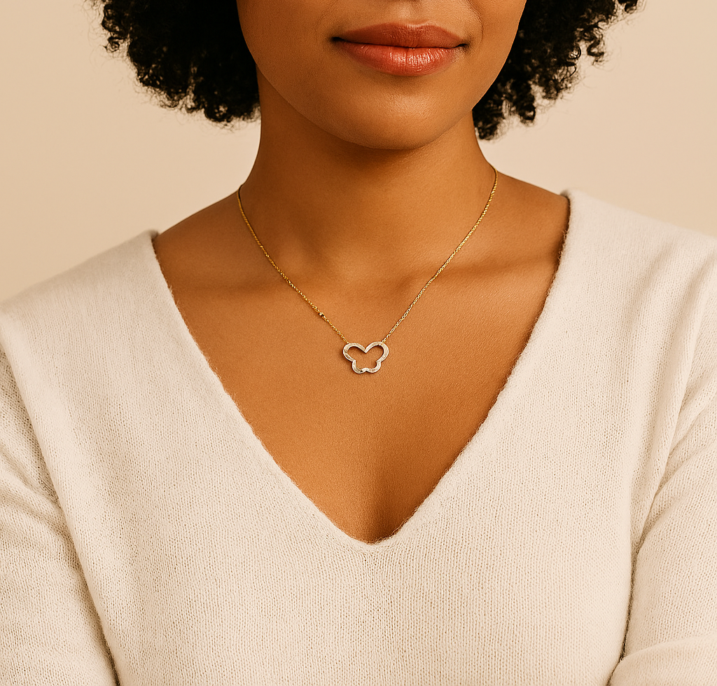 Woman wearing a necklace with a heart pendant against a beige background