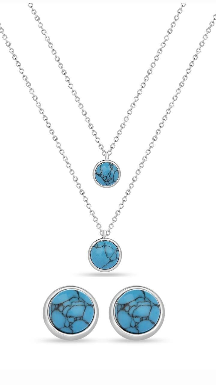 A set of blue round hypoallergenic steel necklace and earrings with a single blue stone in the center of each piece.
