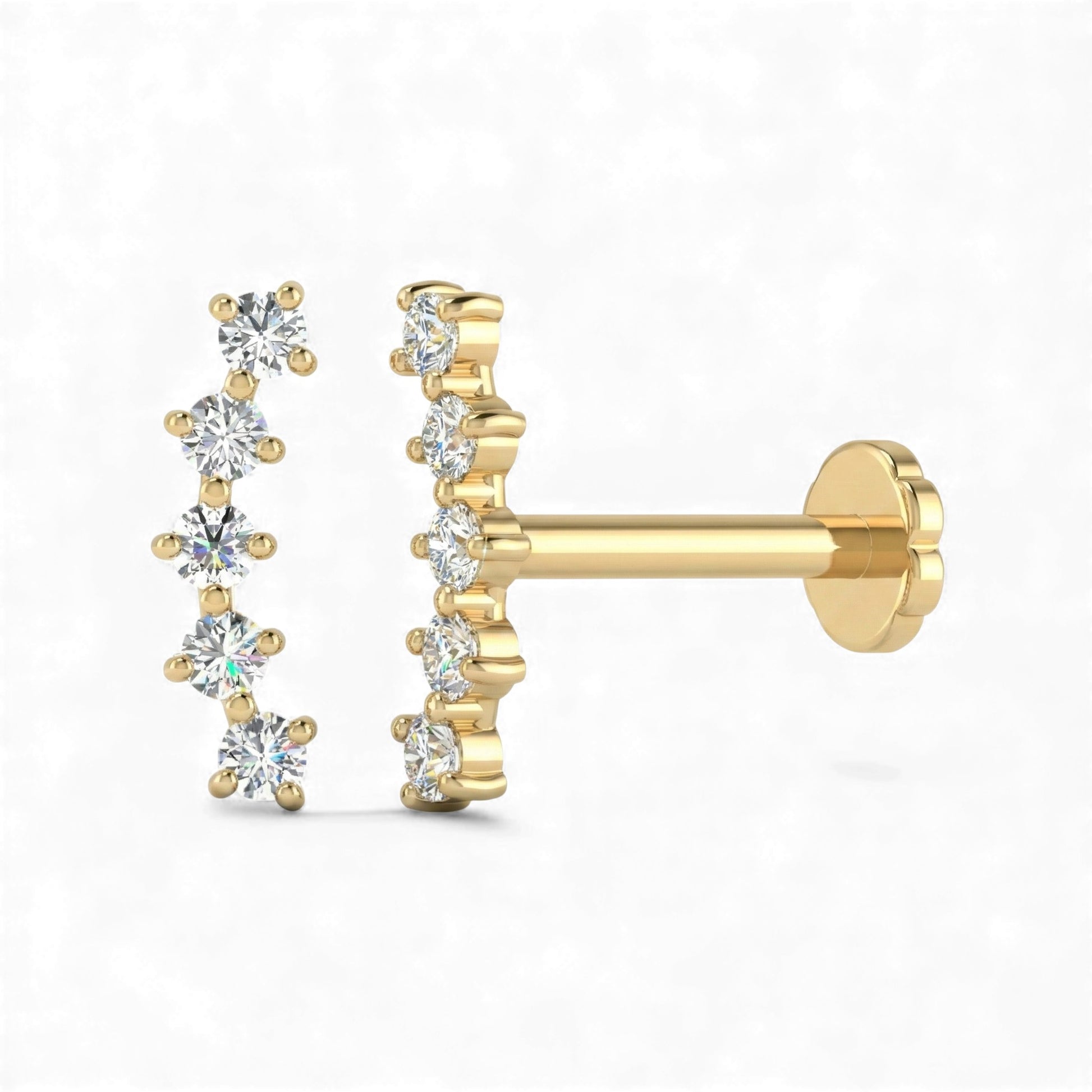 Gold earrings with diamond-like stones on a white background