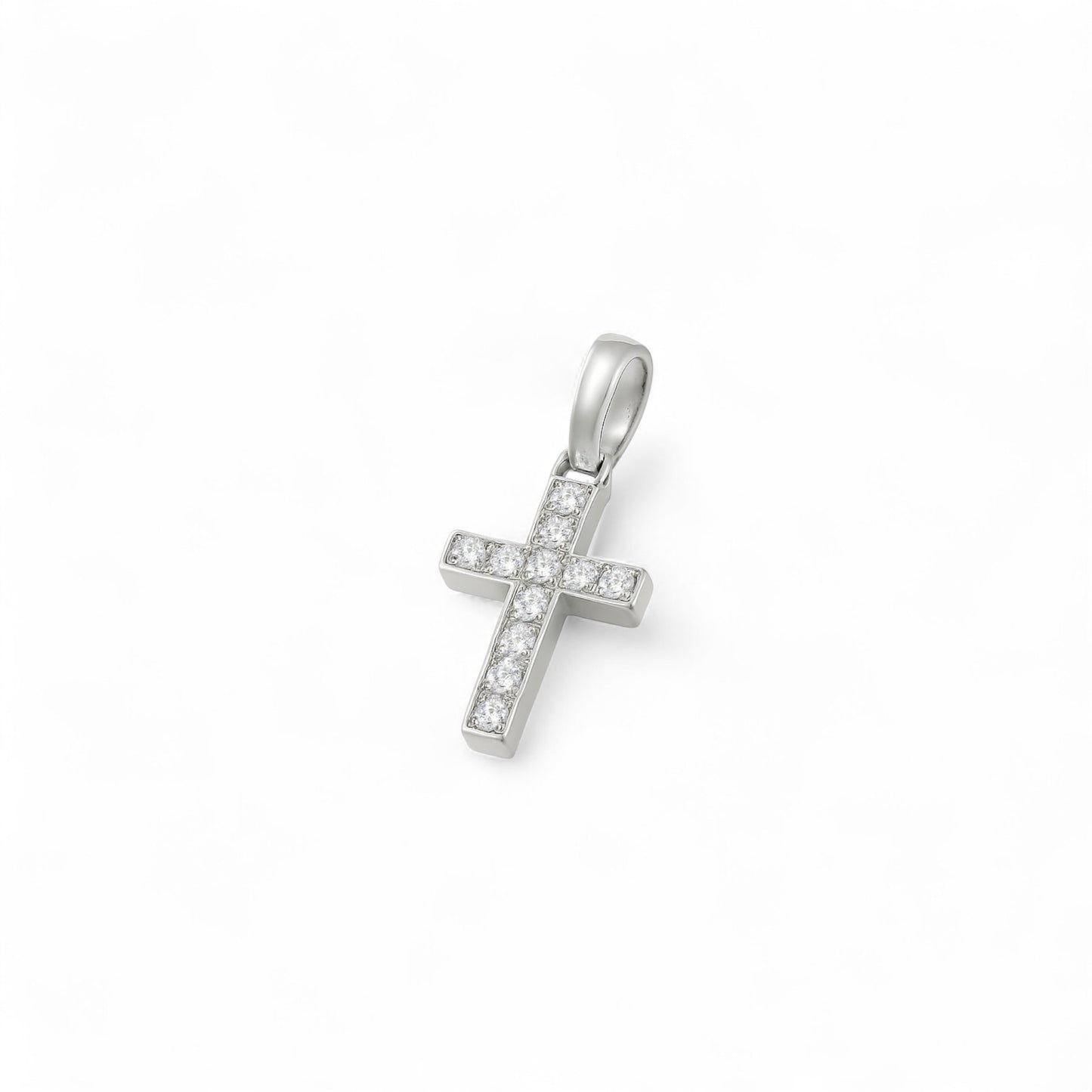 Silver cross pendant with small stones on a white background