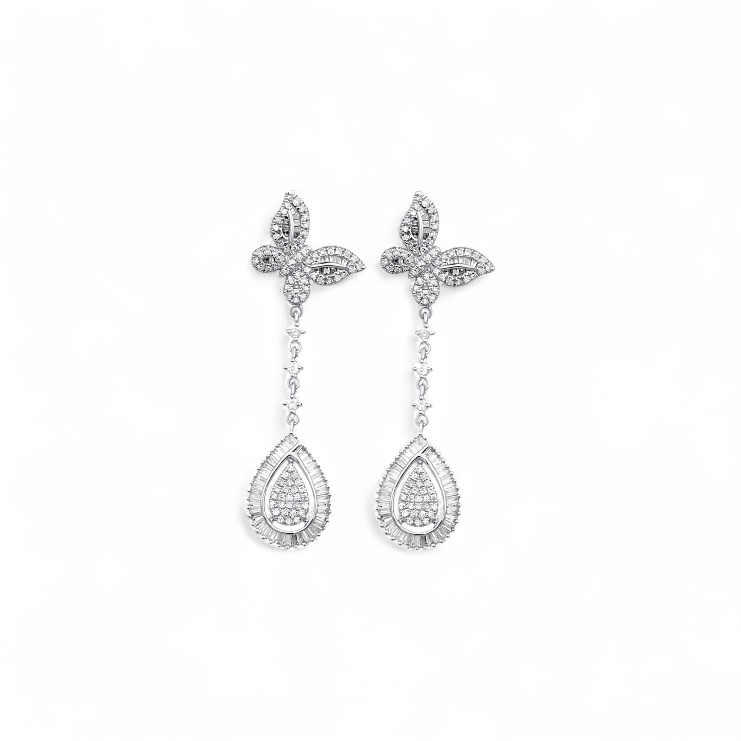 Pair of silver earrings with teardrop-shaped pendants on a white background